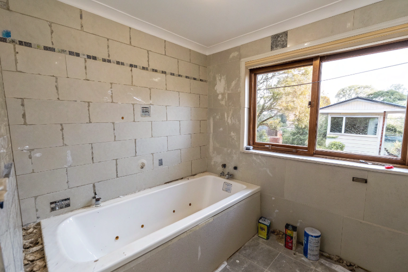 Renovation-ready bathroom wall after professional tile removal in Toronto NSW